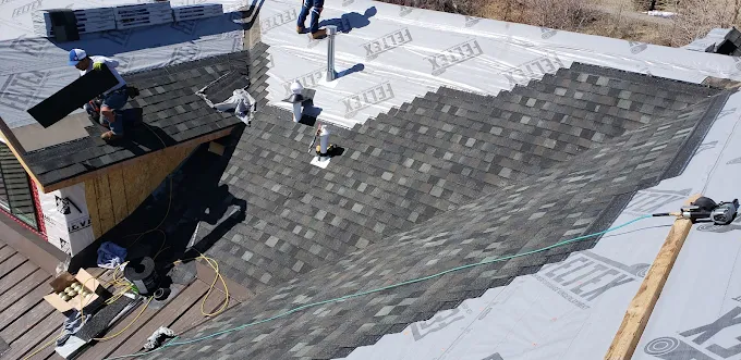 Architectural shingles being installed on a residential roof