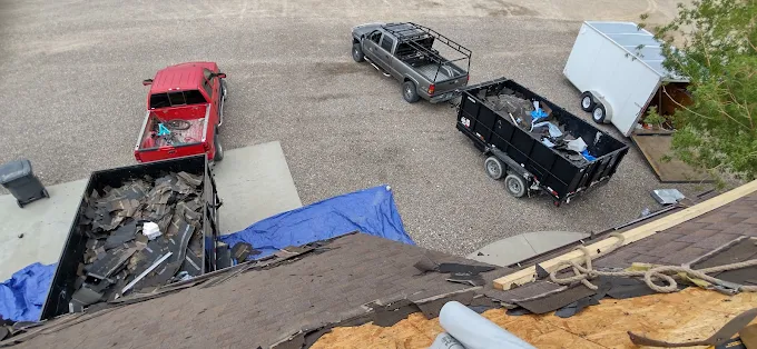 Roof tear-off cleanup after storm damage